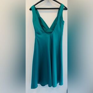 This emerald green satin like dress is perfect for the holidays.